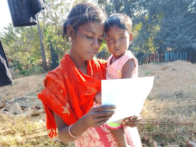 mother reading newsletter